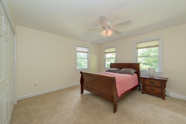 39 R Kimball Road Amesbury, MA 01913 - Photo 23 of 28 a spacious bedroom with a bed and a window