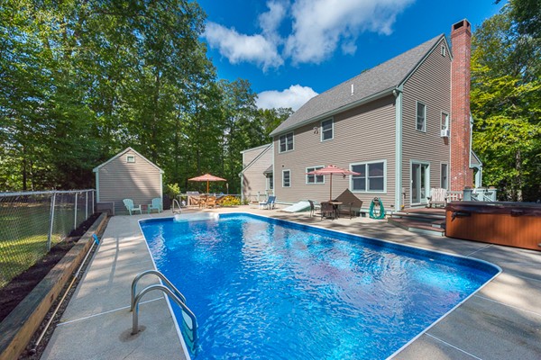 39 R Kimball Road Amesbury, MA 01913 - Photo 3 of 28 a view of swimming pool with outdoor seating and plants