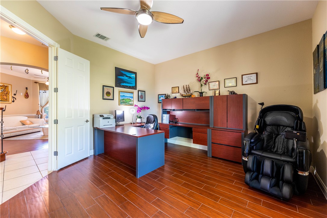 4325 Lago Viento Austin, TX 78734 - Photo 16 of 39 a view of a kitchen with furniture and wooden floor