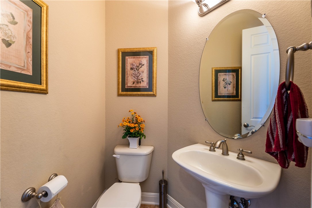 4325 Lago Viento Austin, TX 78734 - Photo 24 of 39 a bathroom with a toilet sink and mirror