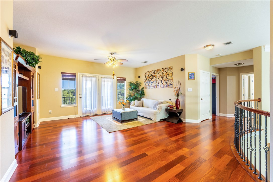 4325 Lago Viento Austin, TX 78734 - Photo 25 of 39 a living room with furniture window and wooden floor