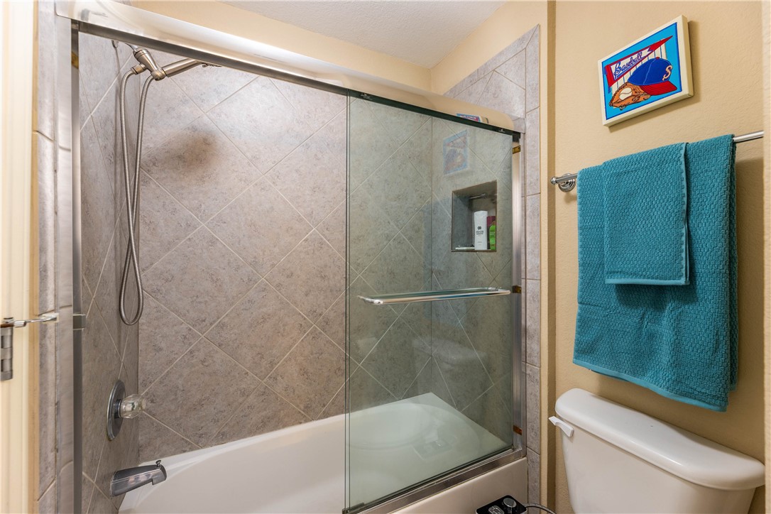 4325 Lago Viento Austin, TX 78734 - Photo 28 of 39 a bathroom with a shower and a toilet