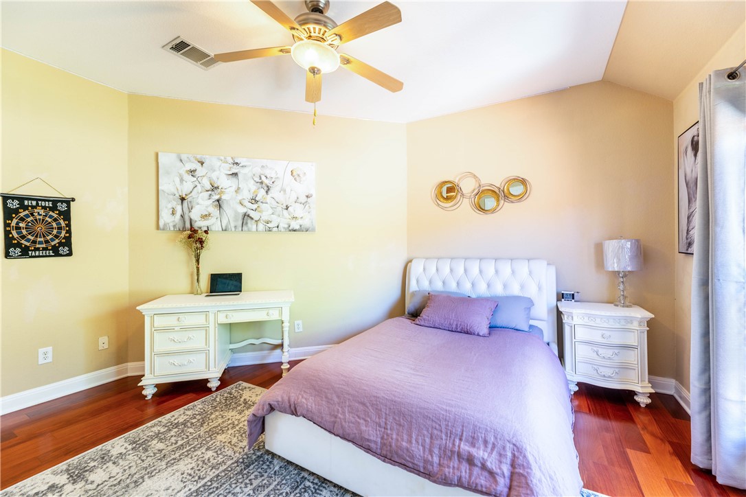 4325 Lago Viento Austin, TX 78734 - Photo 30 of 39 a bedroom with a bed and a table in it
