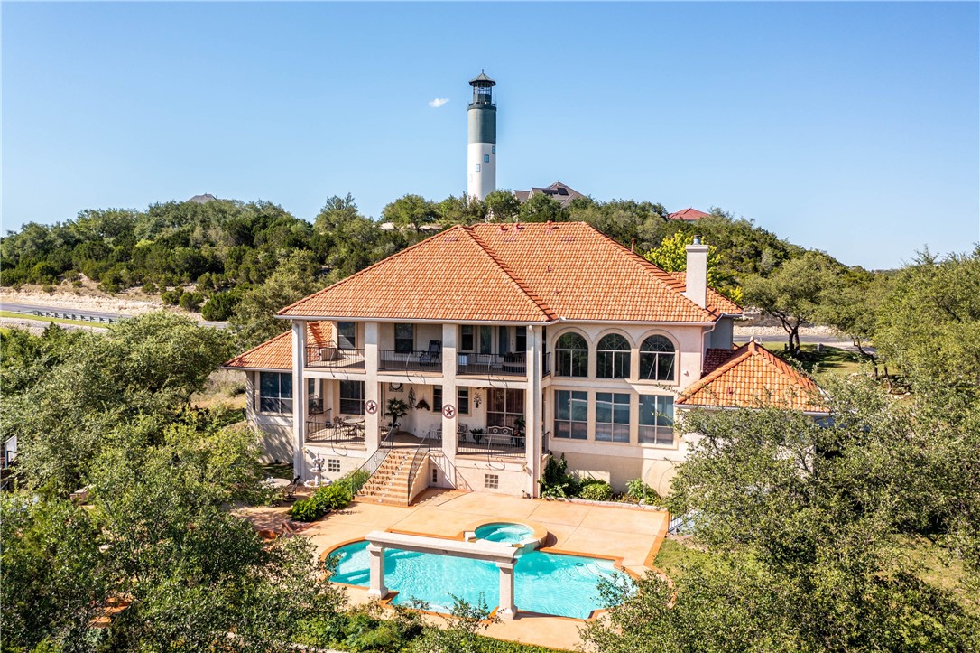 4325 Lago Viento Austin, TX 78734 - Photo 3 of 39 a front view of a house with a garden