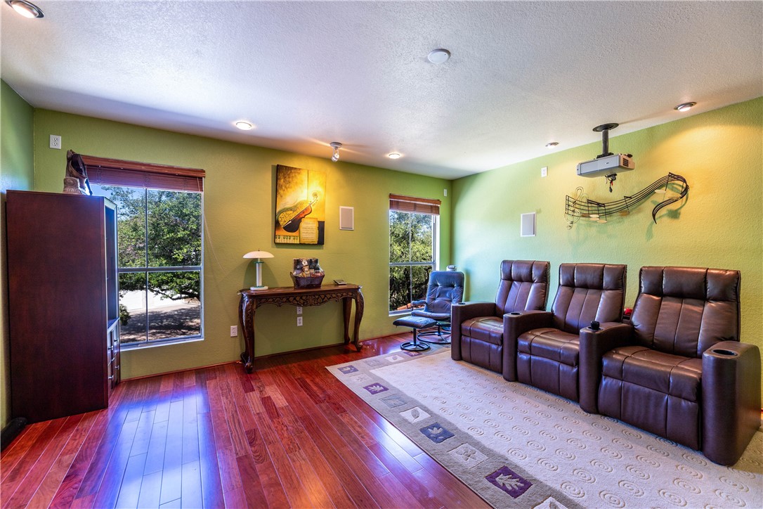 4325 Lago Viento Austin, TX 78734 - Photo 32 of 39 a living room with furniture and a wooden floor