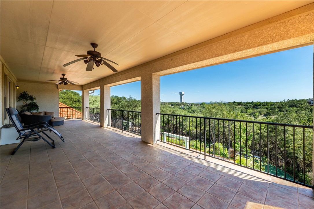 4325 Lago Viento Austin, TX 78734 - Photo 33 of 39 a view of a chairs and table in patio with a small yard
