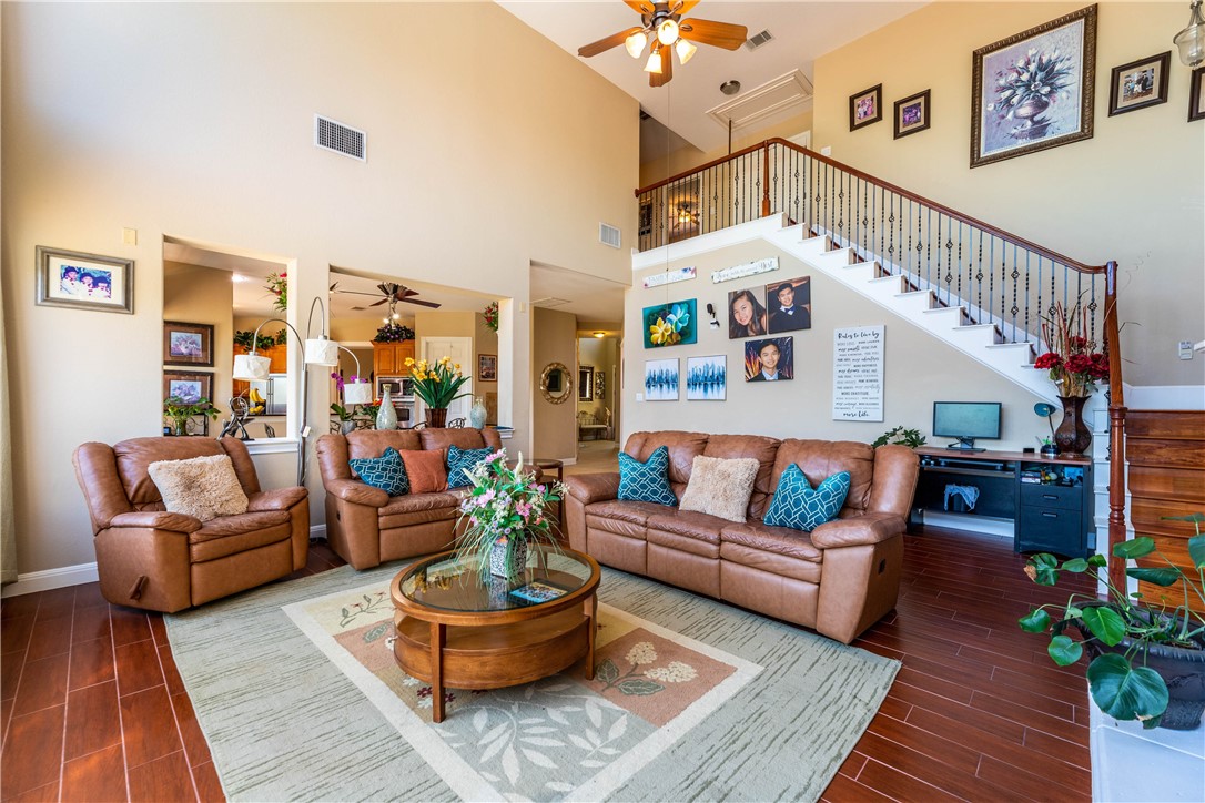 4325 Lago Viento Austin, TX 78734 - Photo 8 of 39 a living room with furniture and a book shelf