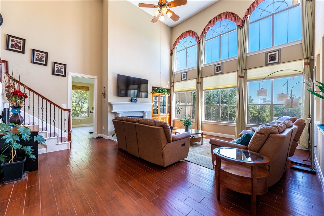 4325 Lago Viento Austin, TX 78734 - Photo 9 of 39 a living room with furniture fireplace and flat screen tv