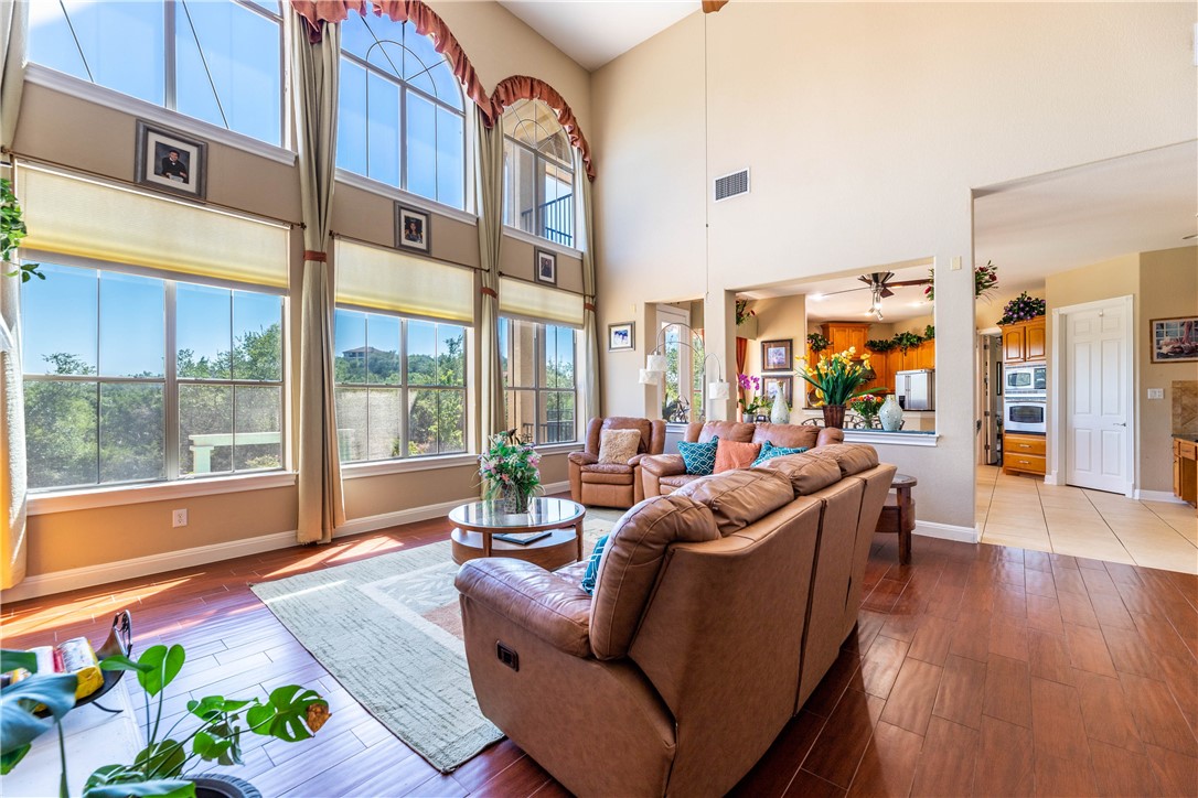 4325 Lago Viento Austin, TX 78734 - Photo 10 of 39 a living room with furniture and a large window