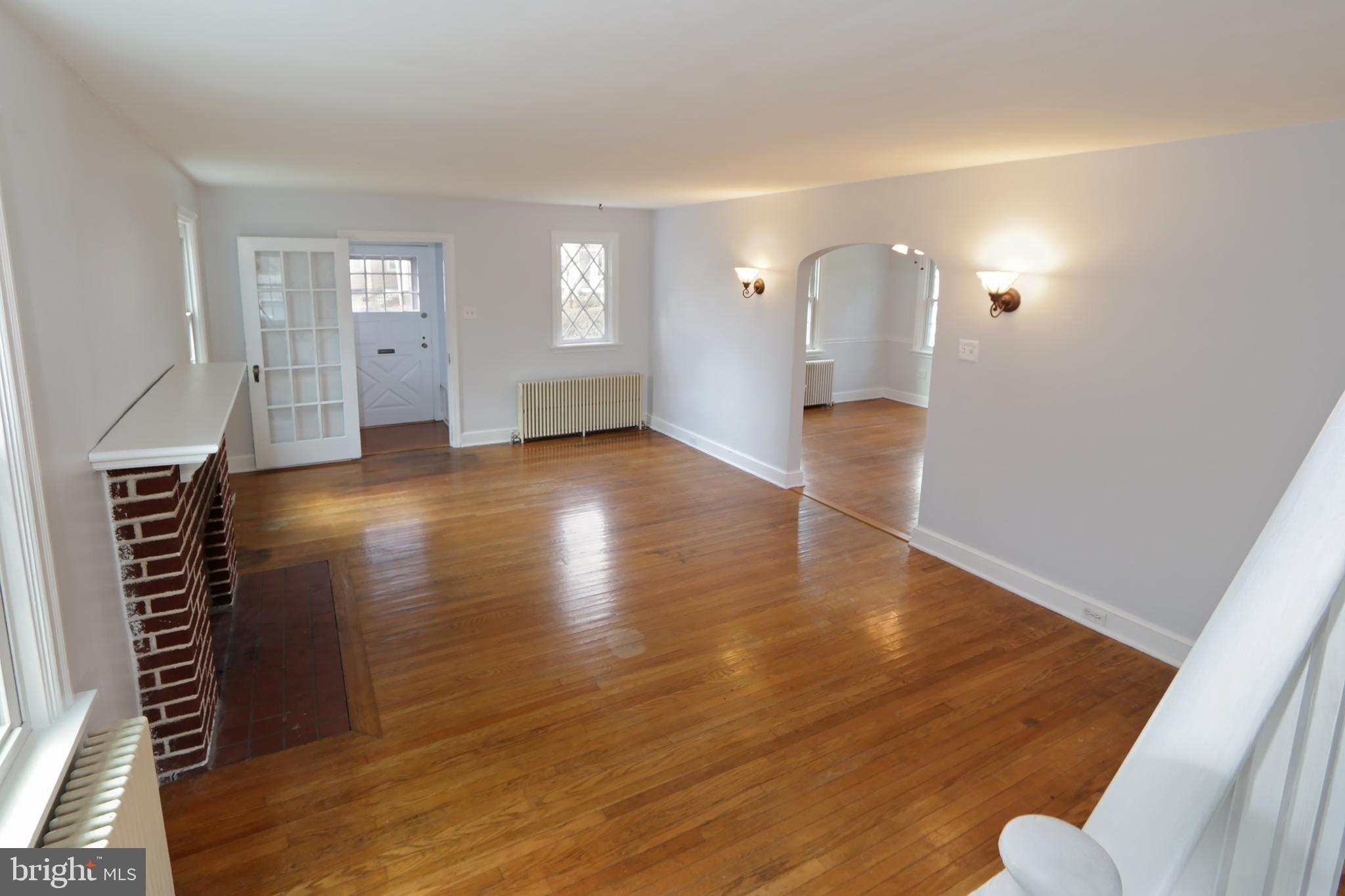 606 Pleasure Road Lancaster, PA 17601 - Photo 17 of 42 Living room with wood fireplace hardwood floors