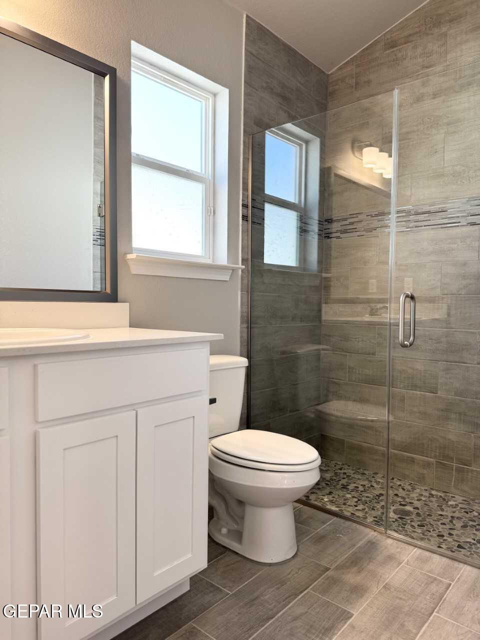 12409 Caddo Lane Clint, TX 79836 - Photo 12 of 13 a bathroom with a toilet sink and shower
