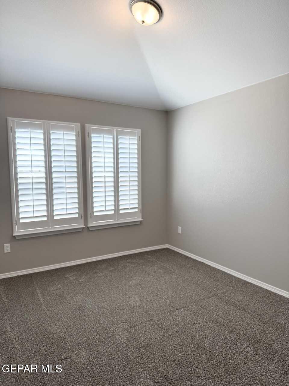 12409 Caddo Lane Clint, TX 79836 - Photo 3 of 13 an empty room with windows