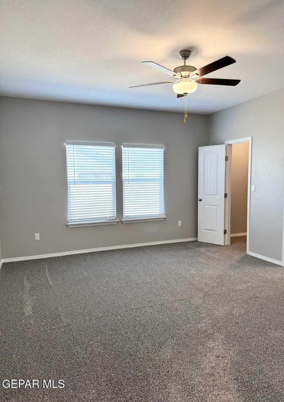12409 Caddo Lane Clint, TX 79836 - Photo 4 of 13 a view of an empty room with a window