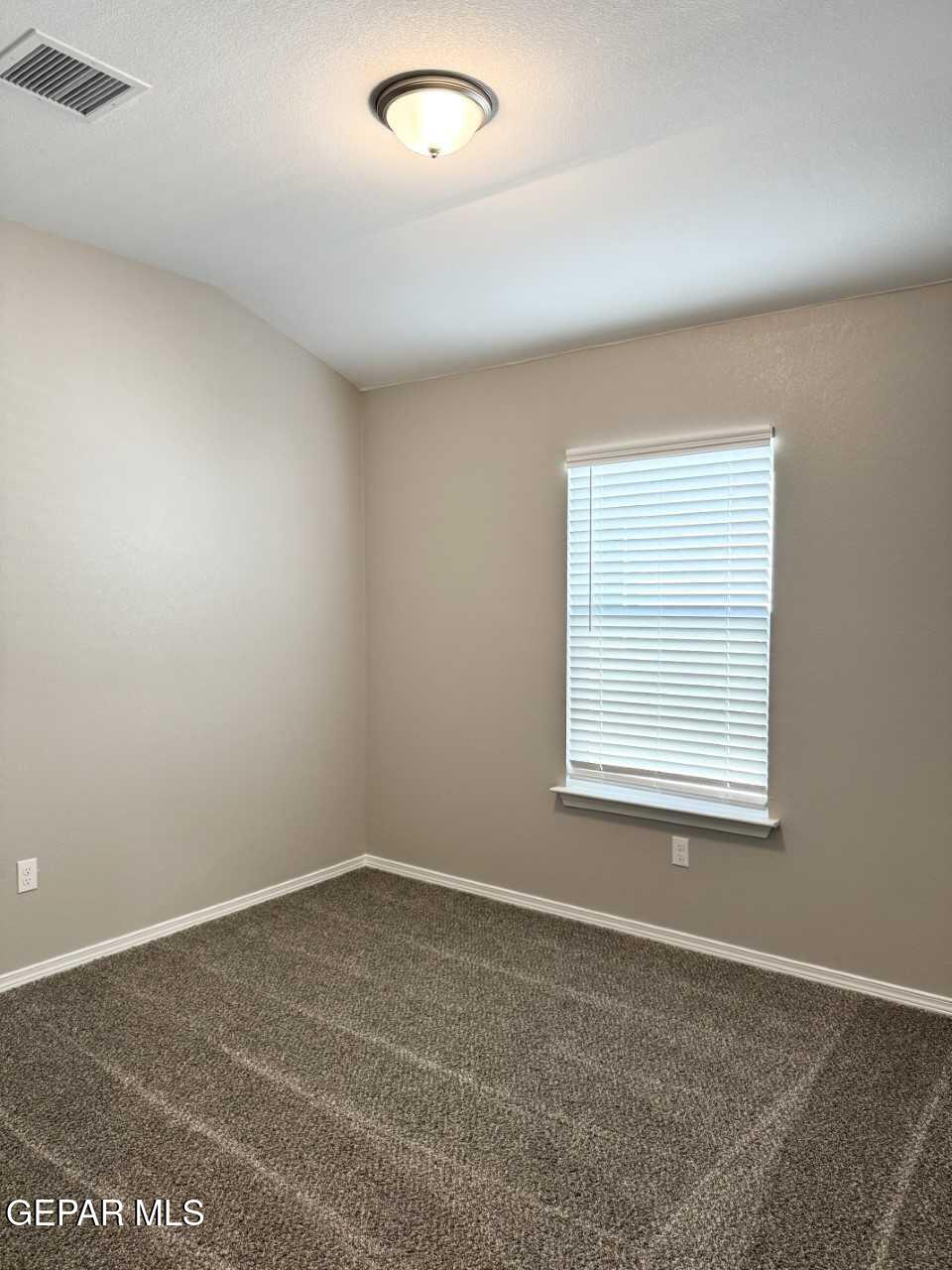 12409 Caddo Lane Clint, TX 79836 - Photo 8 of 13 an empty room with a window