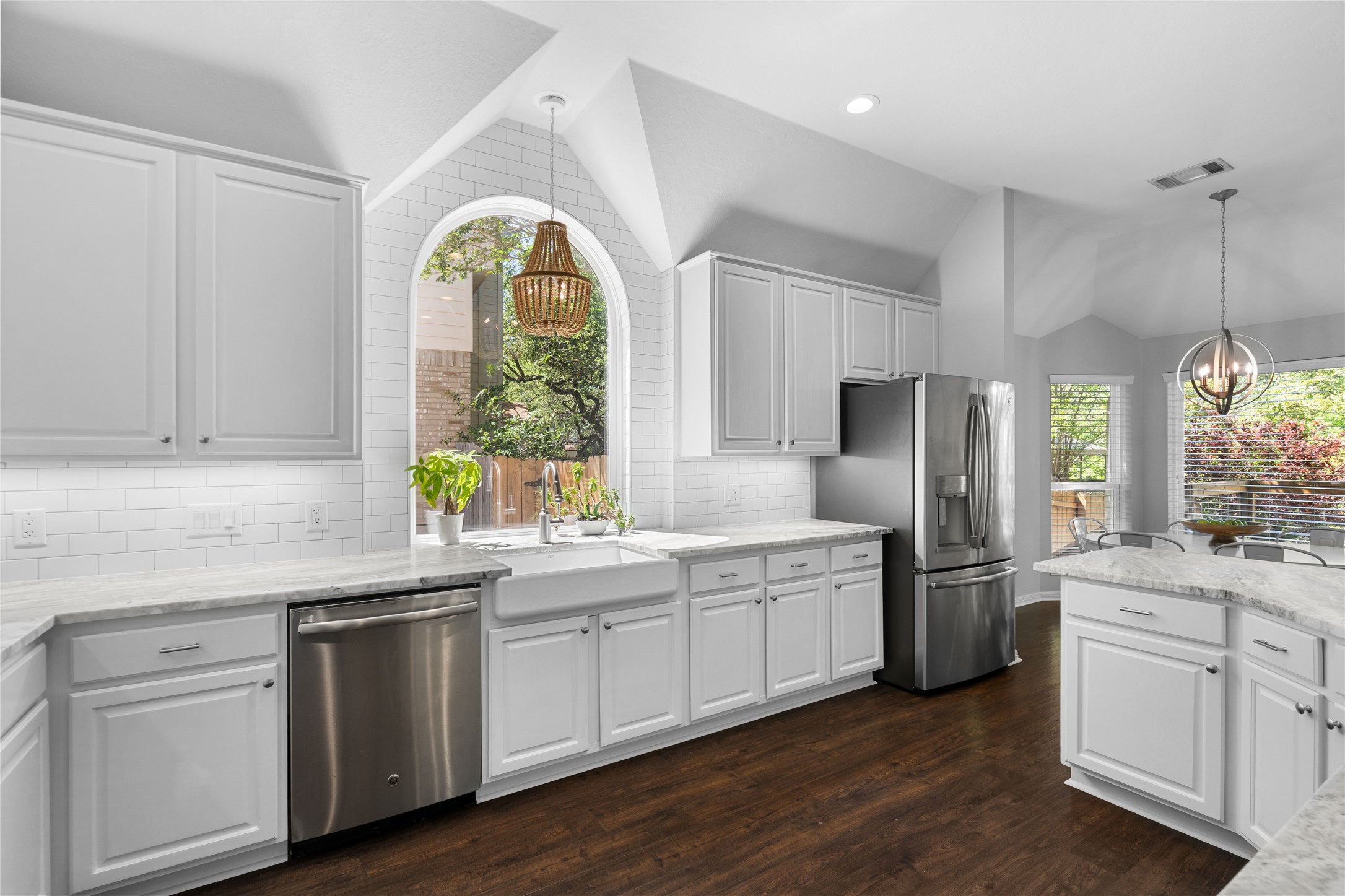 10744 Chestnut Ridge Road Austin, TX 78726 - Photo 13 of 34 Kitchen features large center island, stainless appliances, gas cooking, and quartzite countertops.