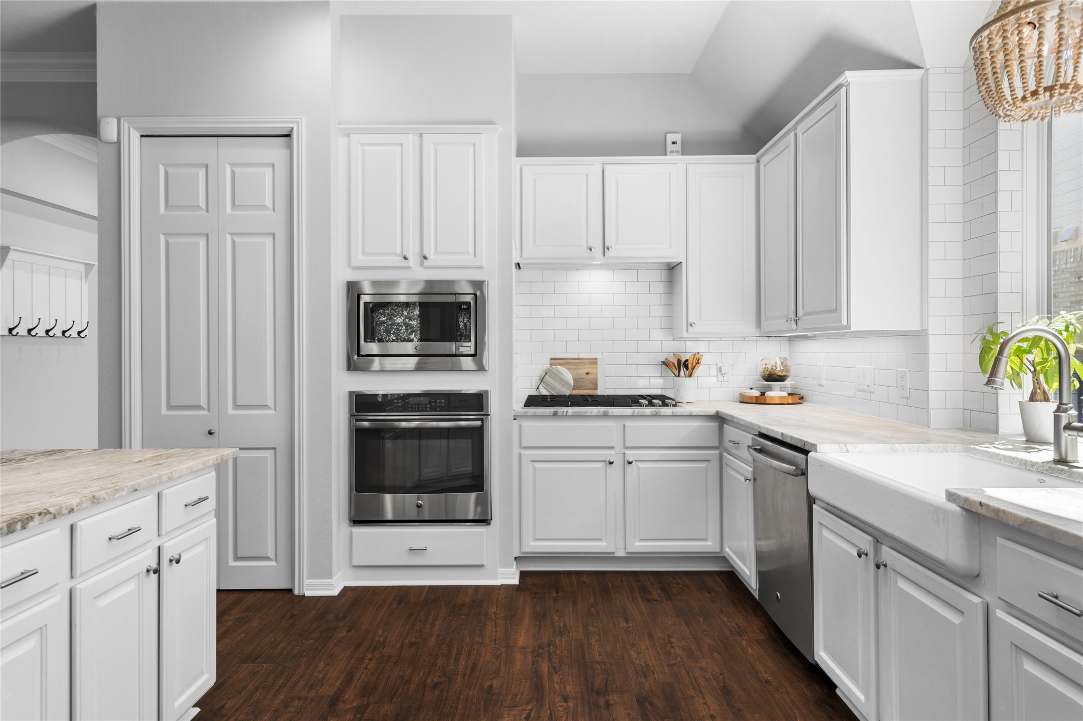 10744 Chestnut Ridge Road Austin, TX 78726 - Photo 14 of 34 Kitchen features large center island, stainless appliances, gas cooking, and quartzite countertops.