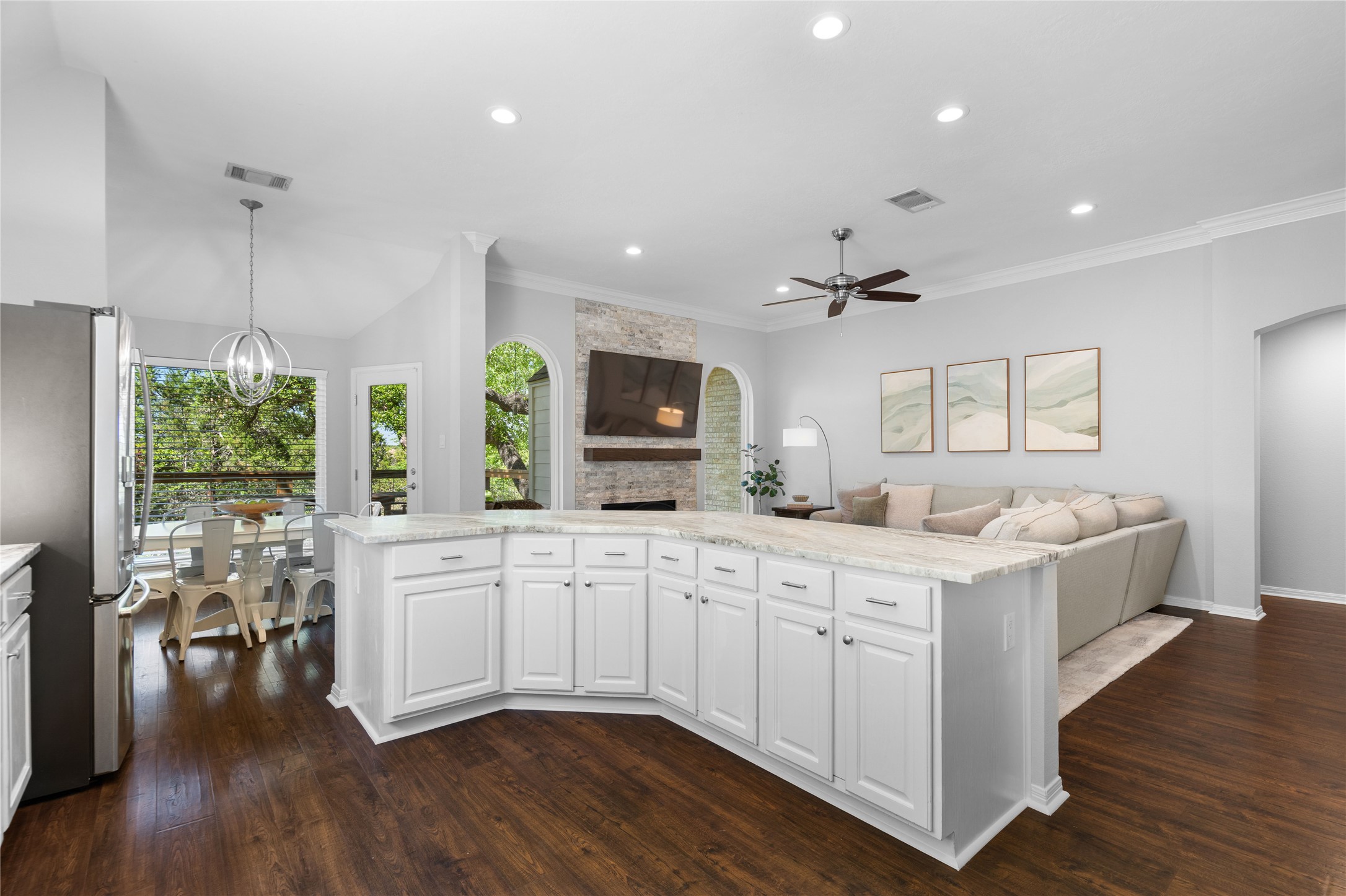 10744 Chestnut Ridge Road Austin, TX 78726 - Photo 15 of 34 Kitchen features large center island, stainless appliances, gas cooking, and quartzite countertops.