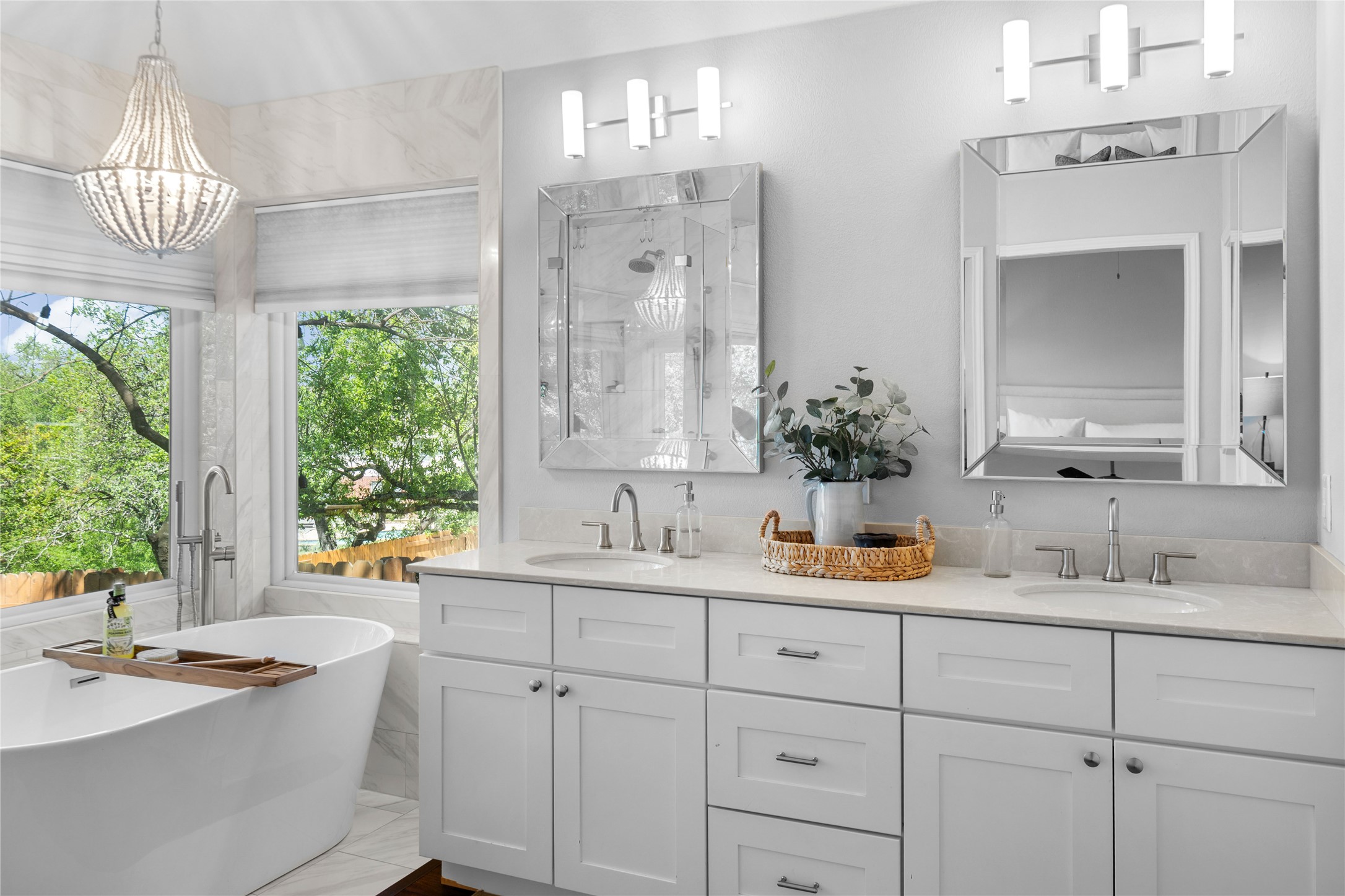 10744 Chestnut Ridge Road Austin, TX 78726 - Photo 22 of 34 Primary Bathroom features a soaking tub, a separate shower, dual vanities, and a walk-in closet.