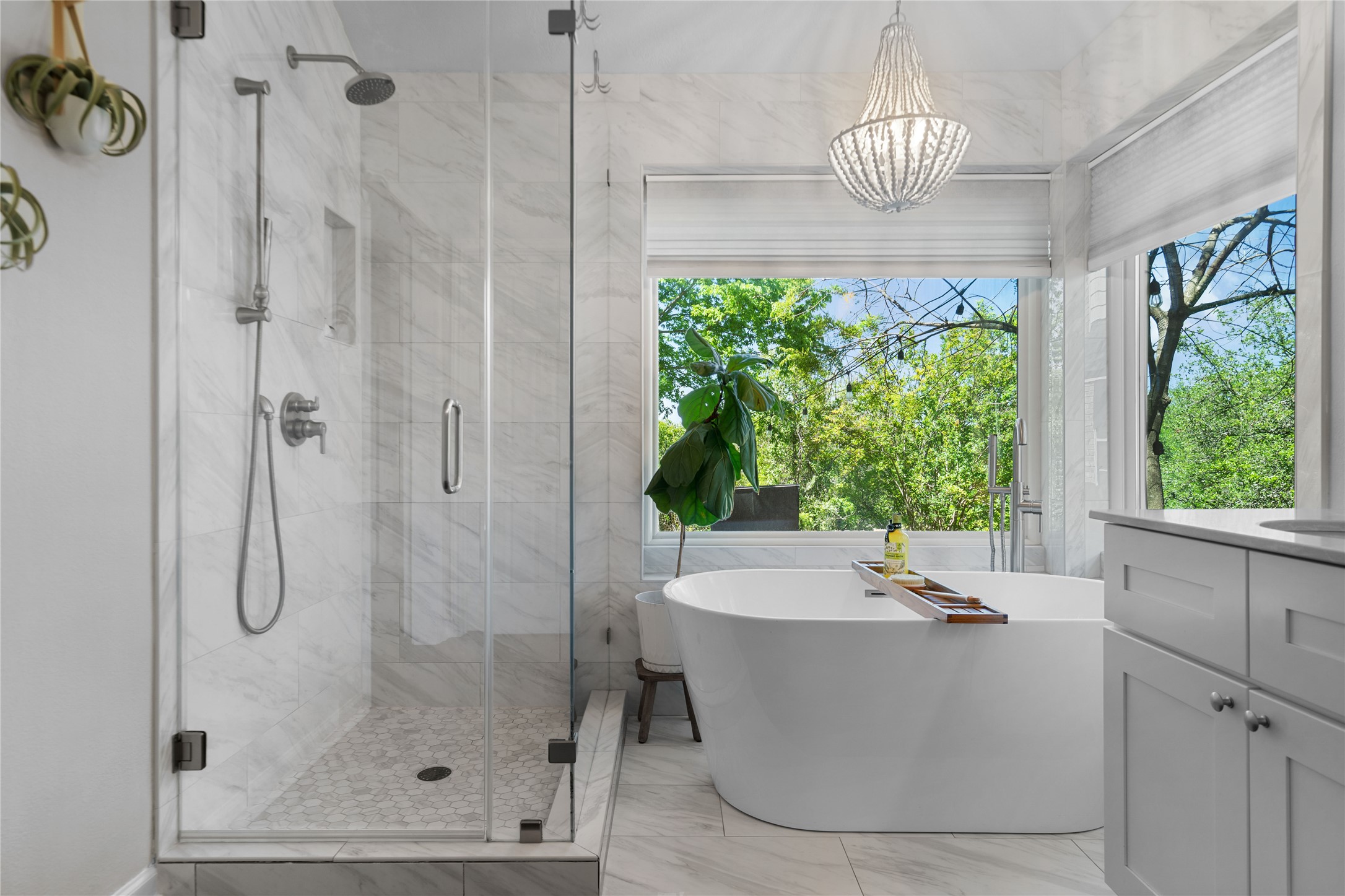 10744 Chestnut Ridge Road Austin, TX 78726 - Photo 23 of 34 Primary Bathroom features a soaking tub, a separate shower, dual vanities, and a walk-in closet.