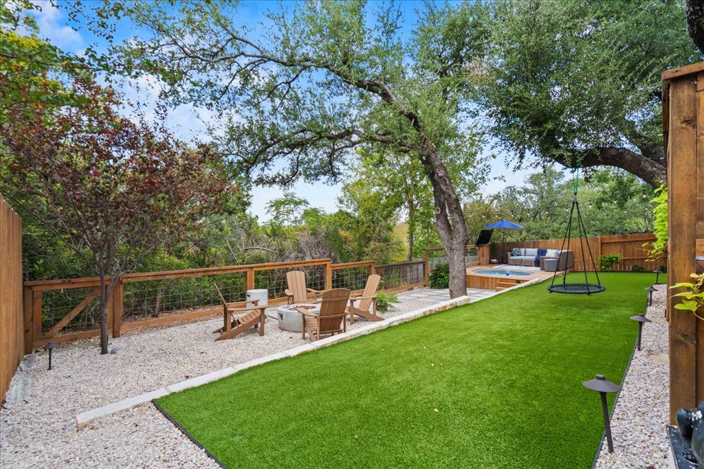 10744 Chestnut Ridge Road Austin, TX 78726 - Photo 30 of 34 Turf creates a low-maintenance setting for relaxation or entertaining.