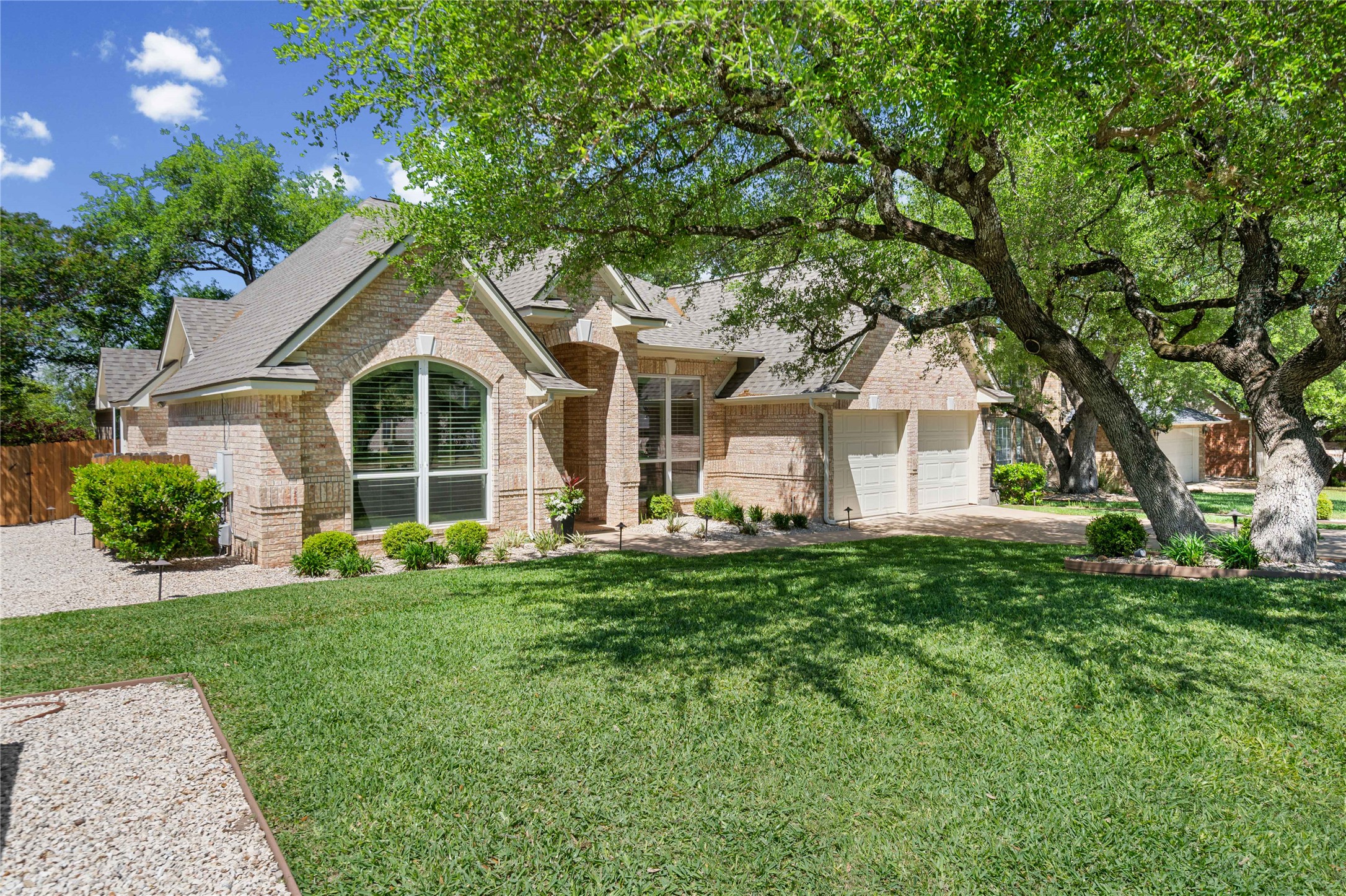 10744 Chestnut Ridge Road Austin, TX 78726 - Photo 3 of 34 Surrounded by mature oak trees and thoughtful landscaping.