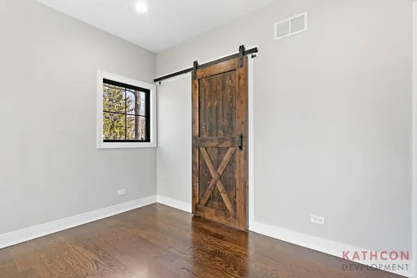 a view of an entryway with wooden floor
