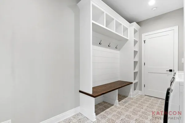 a bathroom with a shower and mirror