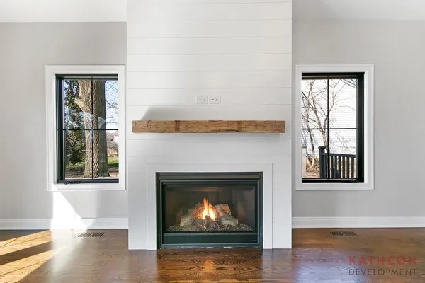 a living room with a fireplace and a fireplace