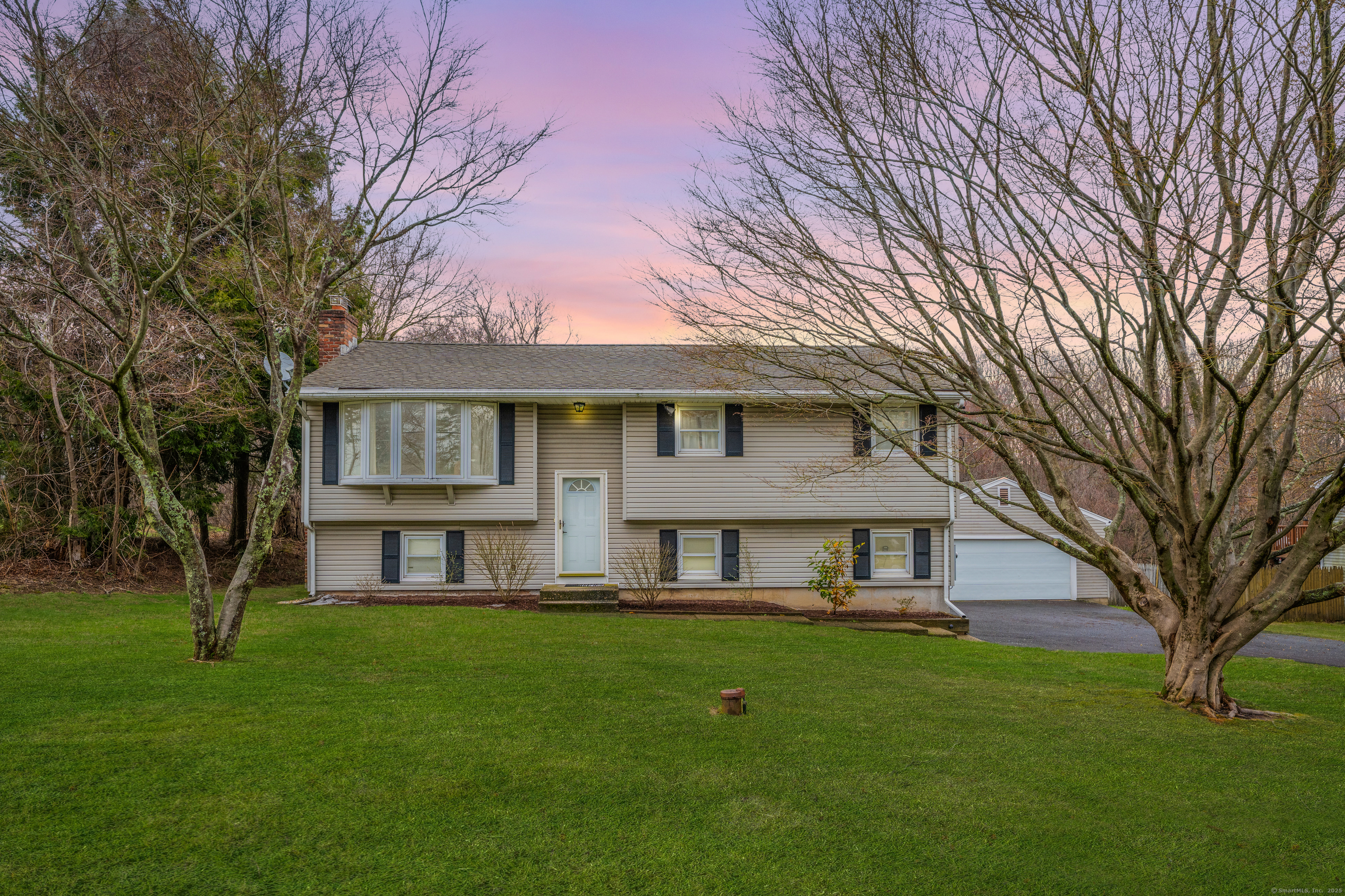 68 Town Line Road Bristol, CT 06010 - Photo 1 of 1 a front view of a house with a yard