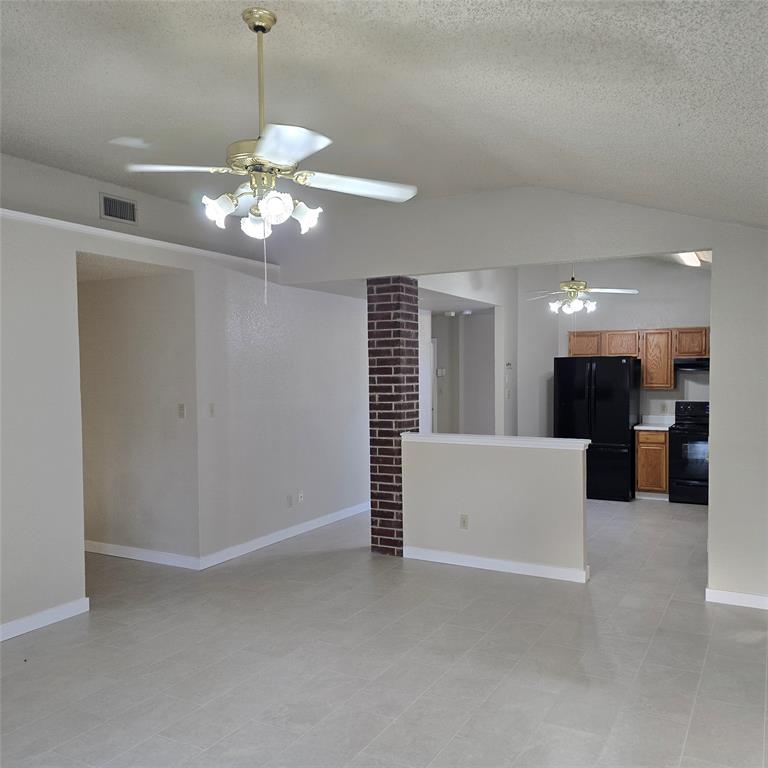 7905 Flowertree Court Fort Worth, TX 76137 - Photo 12 of 17 a view of a livingroom with a chandelier
