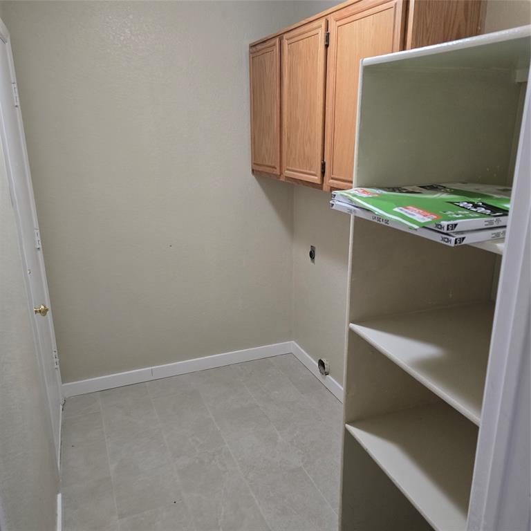 7905 Flowertree Court Fort Worth, TX 76137 - Photo 9 of 17 a utility room with dryer and washer