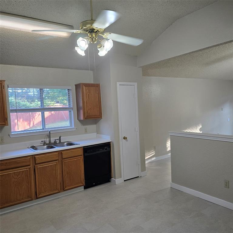 7905 Flowertree Court Fort Worth, TX 76137 - Photo 10 of 17 a bathroom with a sink a toilet and a large mirror