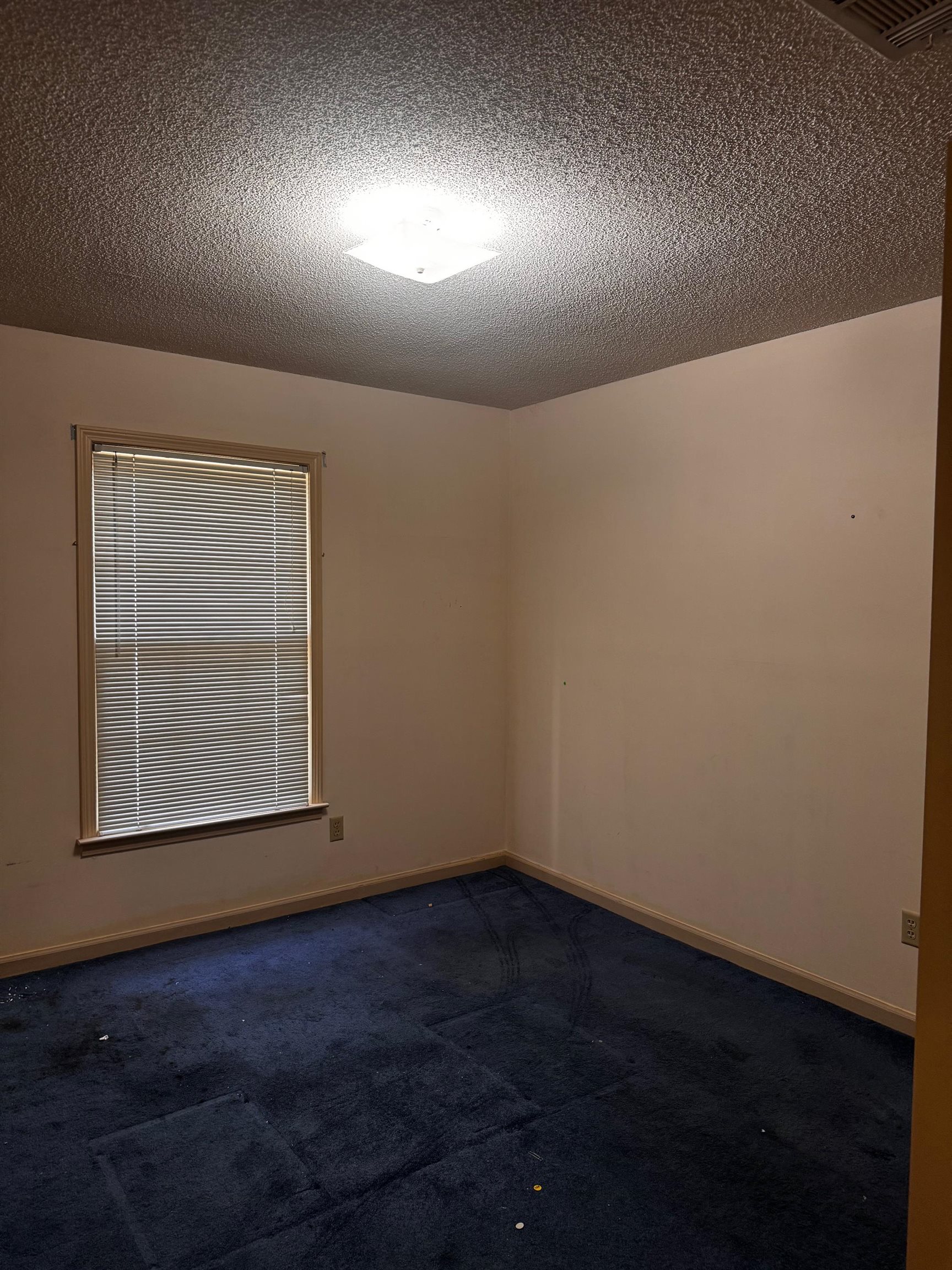 8460 Buckhurst Road Memphis, TN 38016 - Photo 11 of 19 an empty room with a window