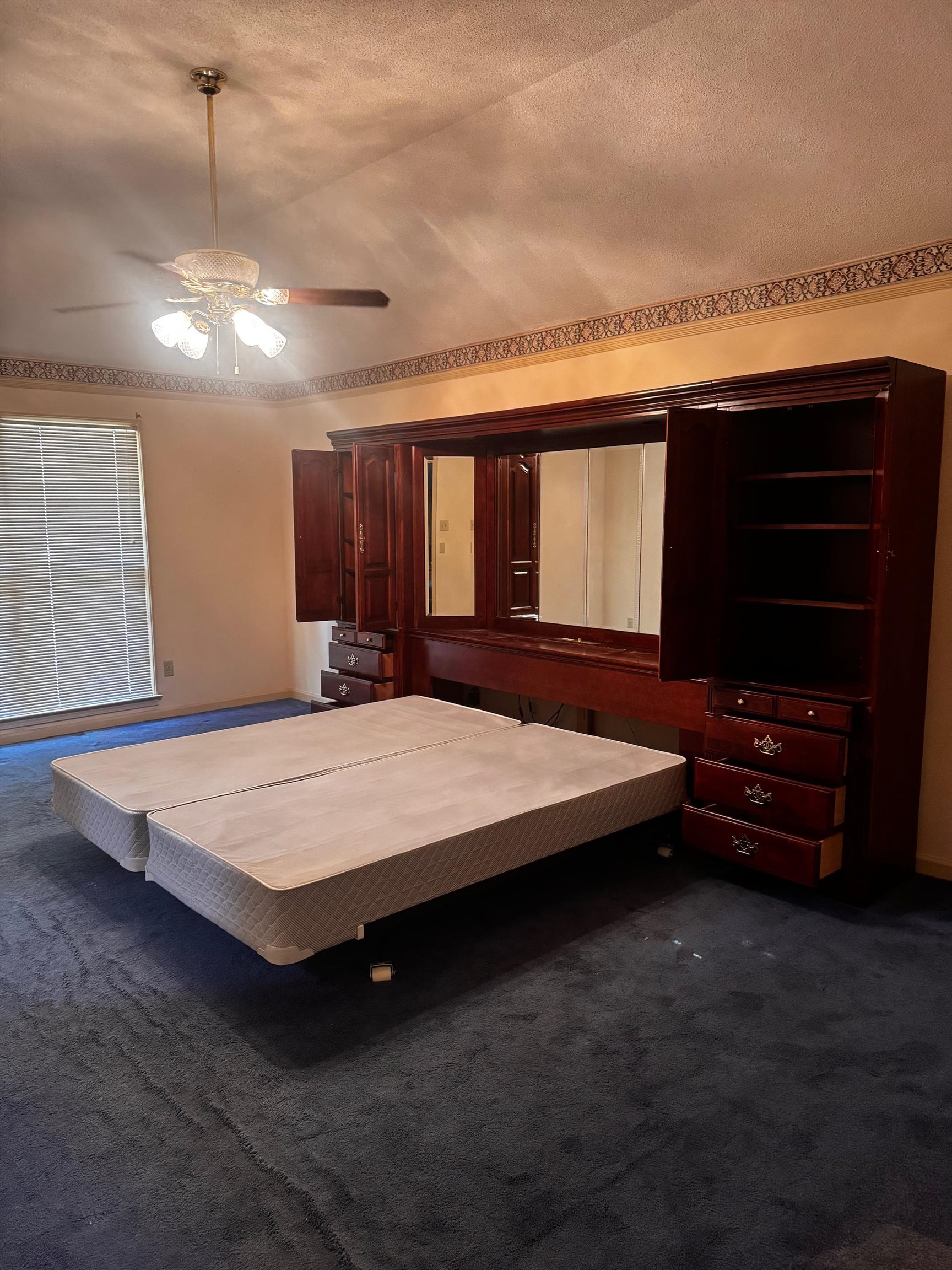 8460 Buckhurst Road Memphis, TN 38016 - Photo 16 of 19 a bed sitting in a room next to a window