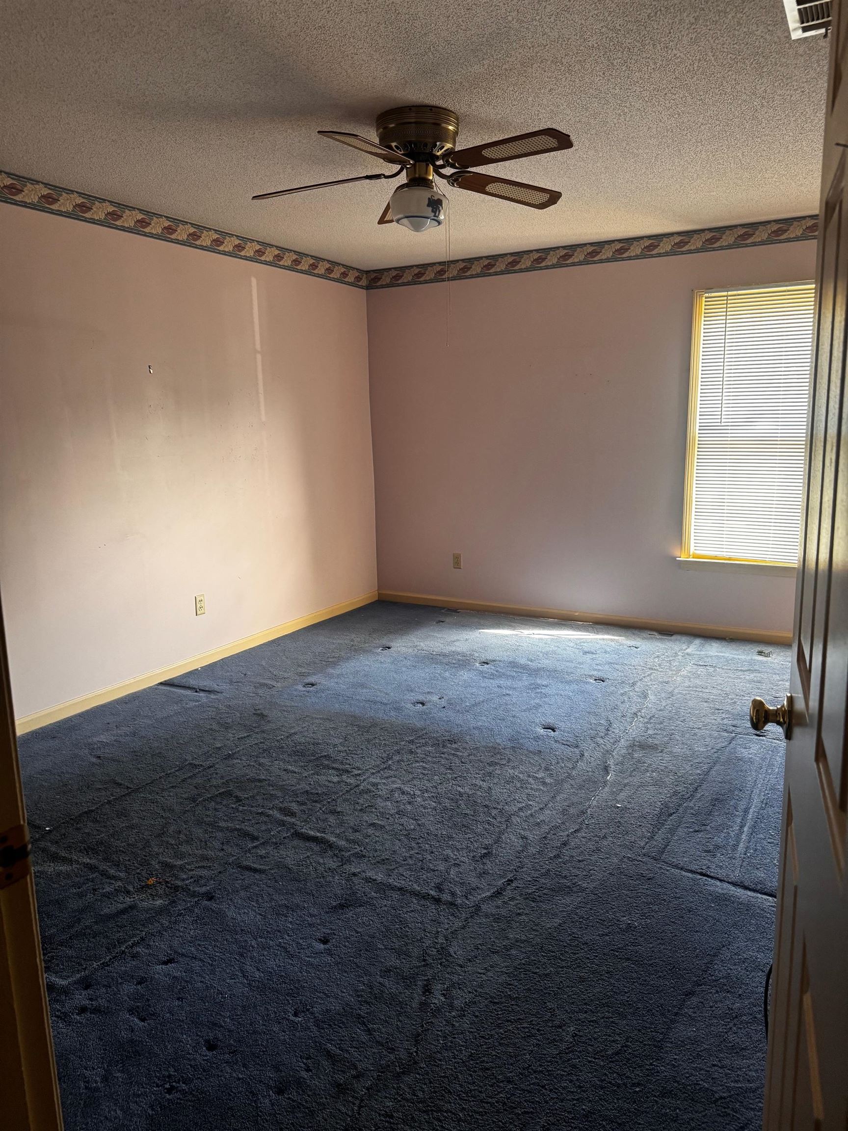 8460 Buckhurst Road Memphis, TN 38016 - Photo 17 of 19 a view of a room with a ceiling fan and wooden floor