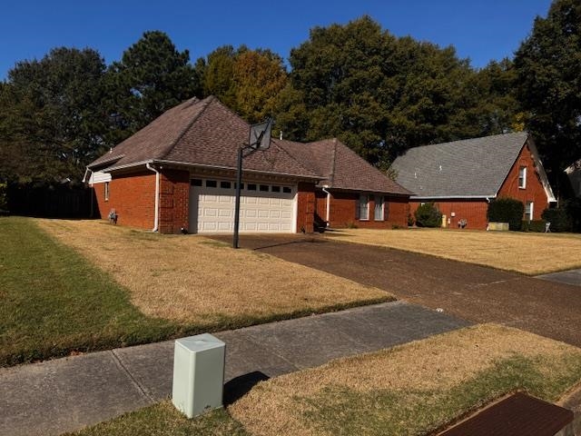 8460 Buckhurst Road Memphis, TN 38016 - Photo 2 of 19 a house with trees in the background