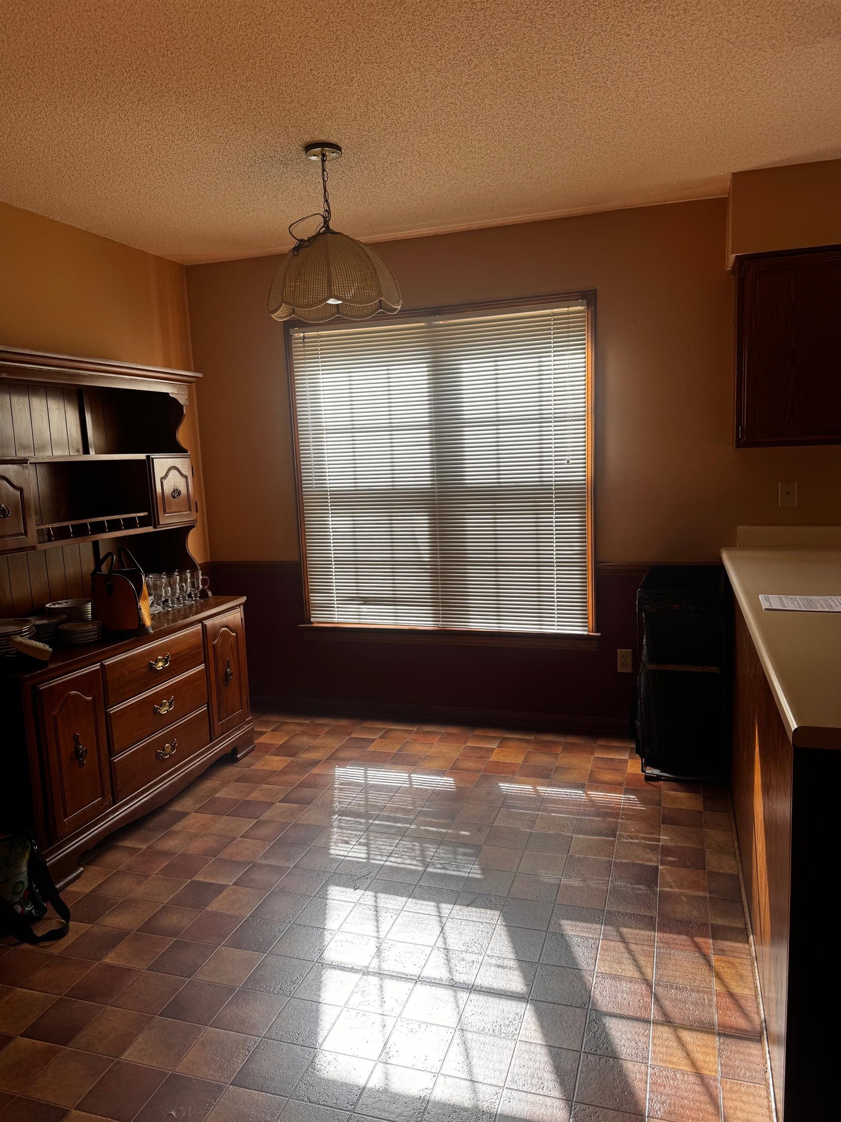 8460 Buckhurst Road Memphis, TN 38016 - Photo 5 of 19 a kitchen with granite countertop a stove a sink and a microwave
