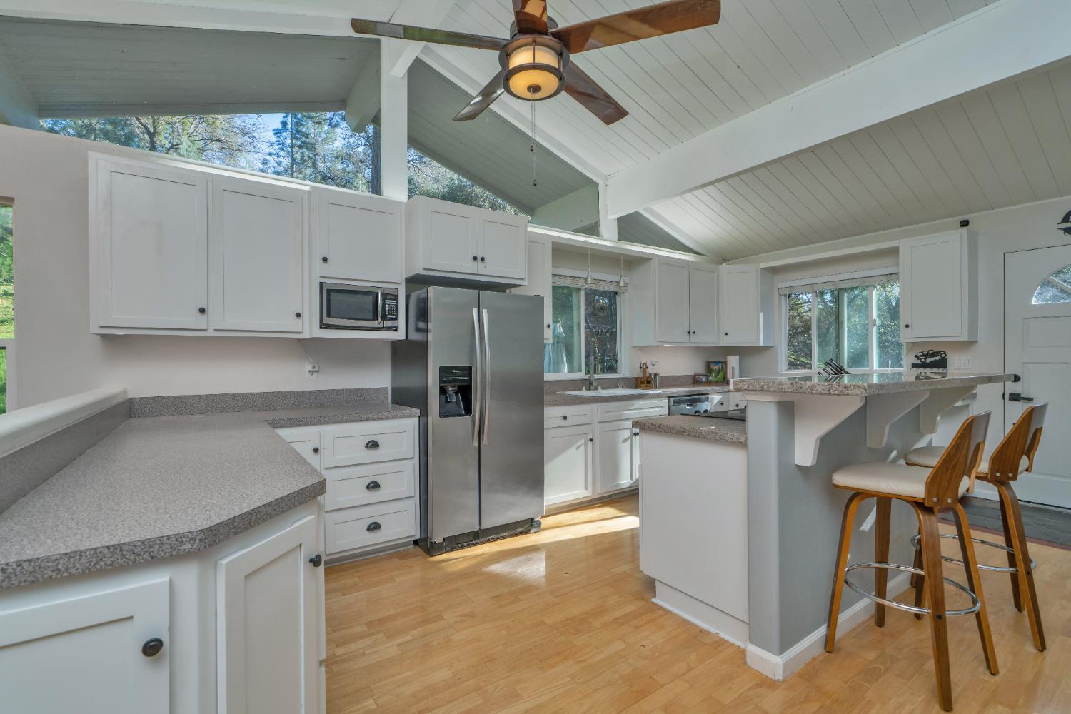 2869 Cascade Trail Cool, CA 95614 - Photo 12 of 80 a kitchen with refrigerator and cabinets
