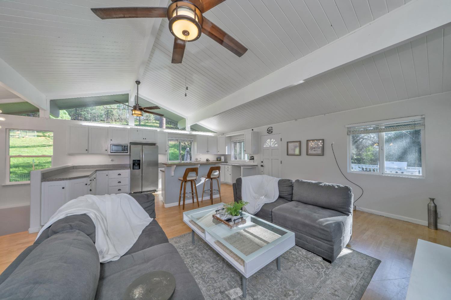 2869 Cascade Trail Cool, CA 95614 - Photo 19 of 80 a living room with furniture kitchen view and a window