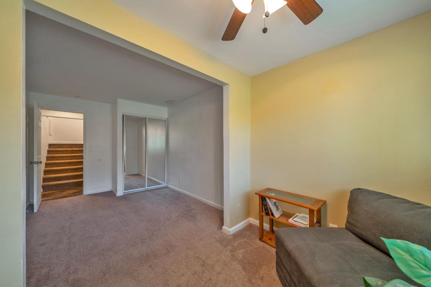 2869 Cascade Trail Cool, CA 95614 - Photo 25 of 80 a view of a livingroom with a chair and a ceiling fan