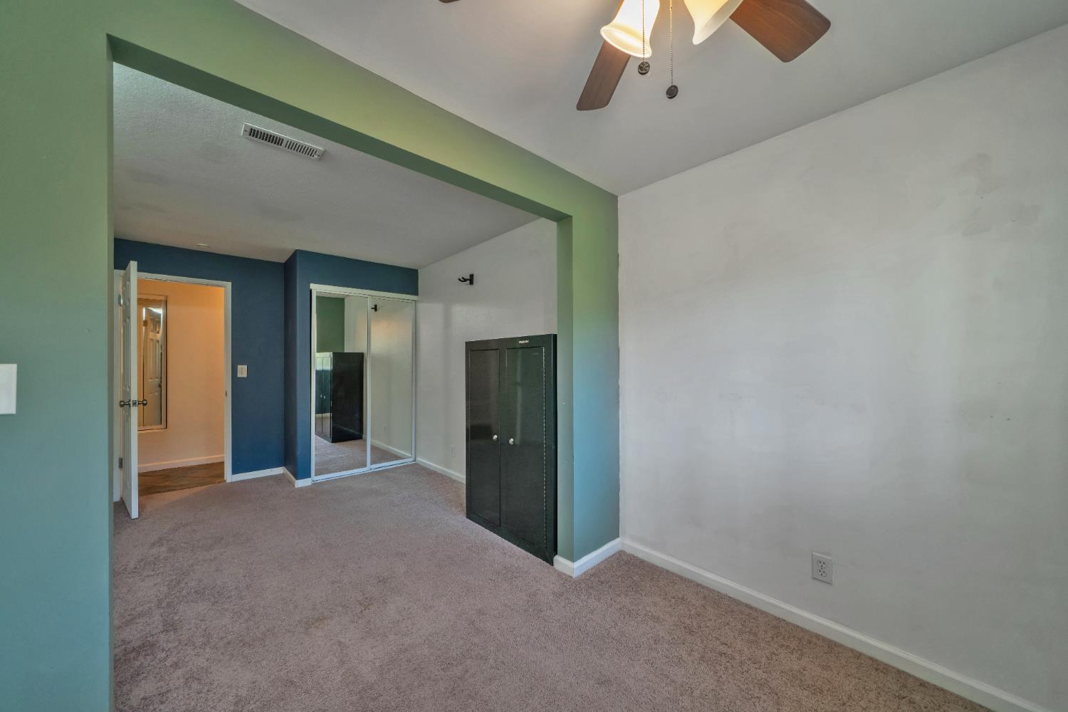 2869 Cascade Trail Cool, CA 95614 - Photo 27 of 80 an empty room with chandelier fan