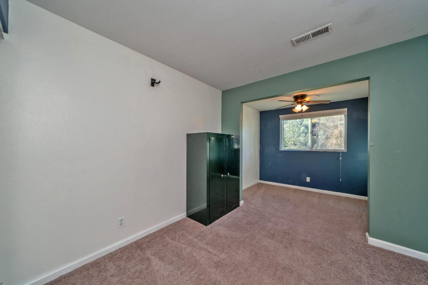 2869 Cascade Trail Cool, CA 95614 - Photo 28 of 80 a view of an empty room with window and closet area