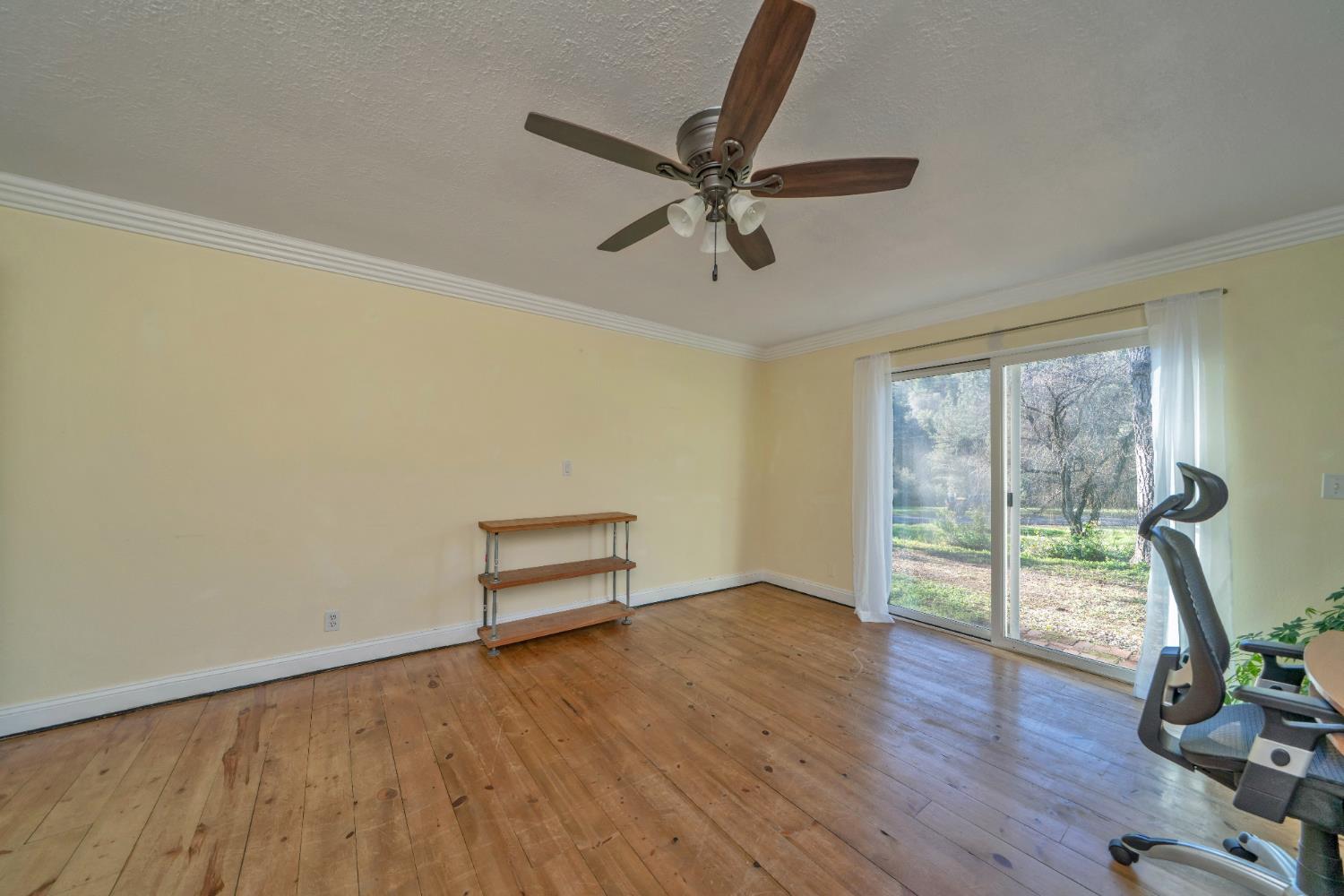 2869 Cascade Trail Cool, CA 95614 - Photo 32 of 80 a view of an empty room with wooden floor and a window