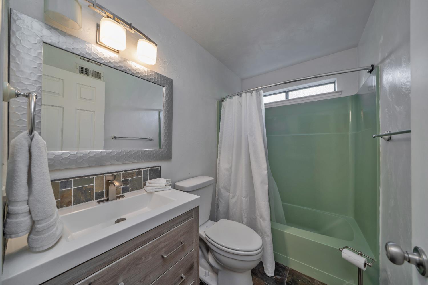 2869 Cascade Trail Cool, CA 95614 - Photo 33 of 80 a bathroom with a sink a toilet and shower