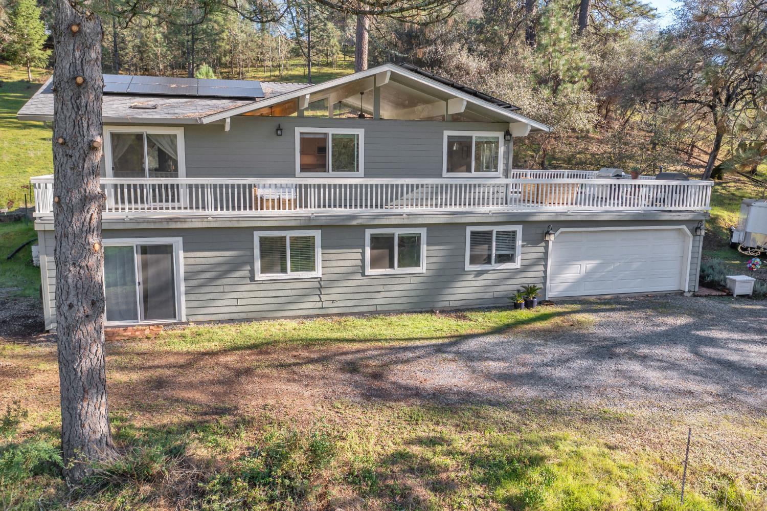 2869 Cascade Trail Cool, CA 95614 - Photo 49 of 80 a front view of a house with a yard