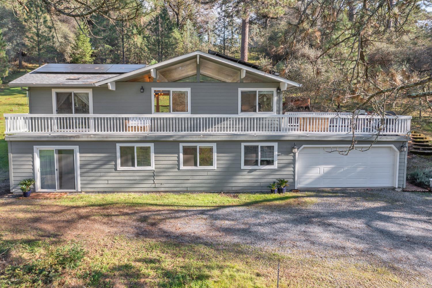 2869 Cascade Trail Cool, CA 95614 - Photo 50 of 80 a front view of a house with a yard
