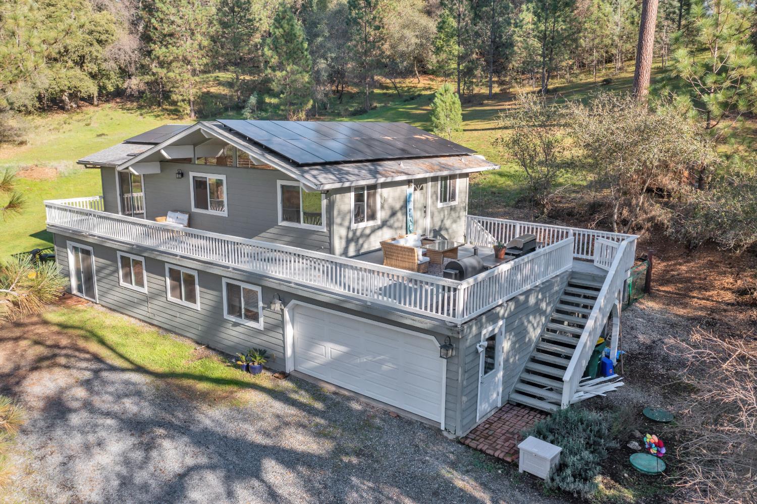 2869 Cascade Trail Cool, CA 95614 - Photo 52 of 80 a aerial view of a house with a yard and balcony