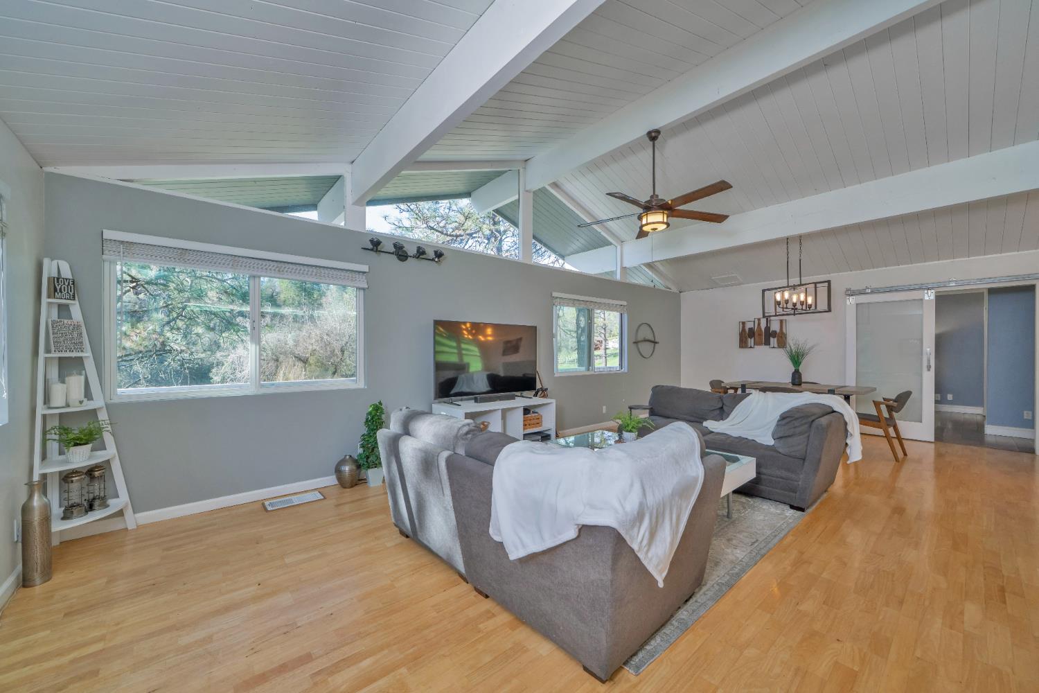 2869 Cascade Trail Cool, CA 95614 - Photo 6 of 80 a living room with furniture and a flat screen tv