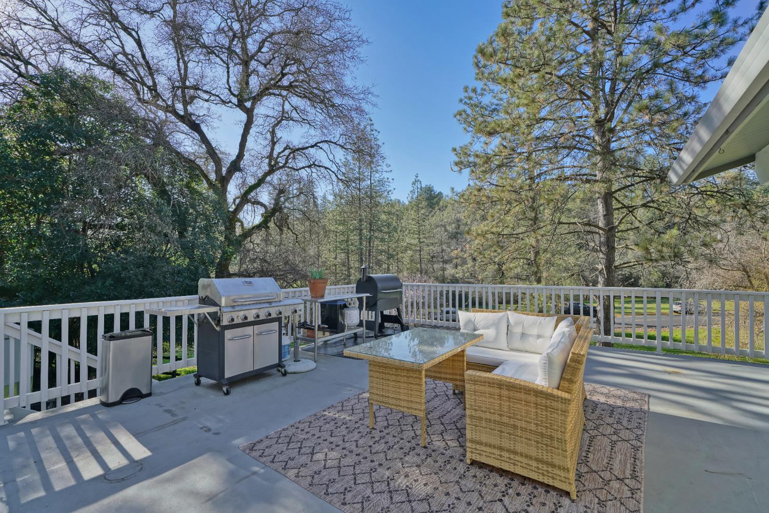 2869 Cascade Trail Cool, CA 95614 - Photo 74 of 80 a view of a patio with couches chairs and wooden floor