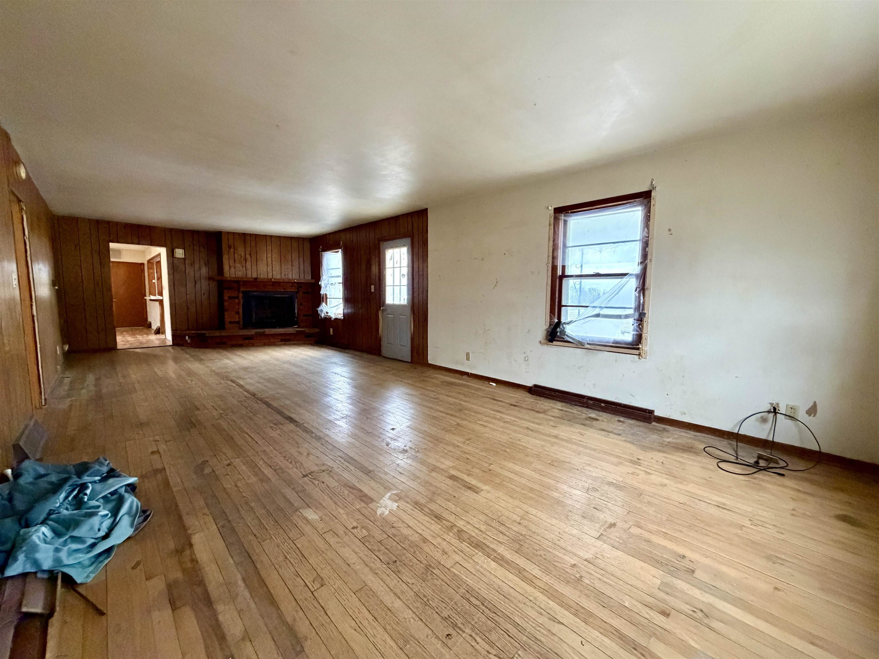 3517 North Henderson Road Freeport, IL 61032 - Photo 13 of 26 a view of a livingroom with wooden floor and a kitchen
